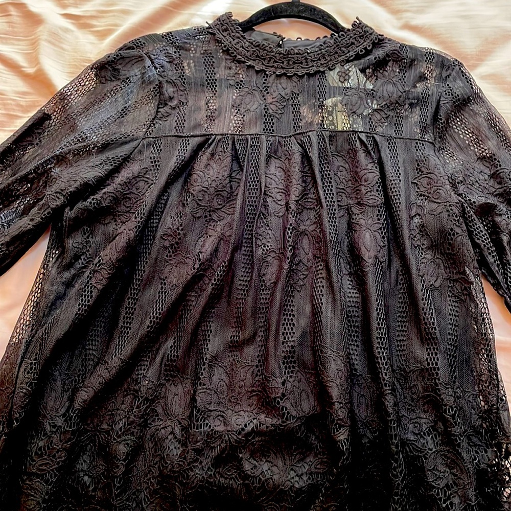 Black lace blouse with a price tag. Never worn